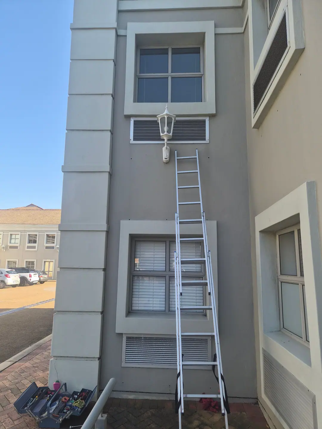 Exterior lighting work on a double-storey office building