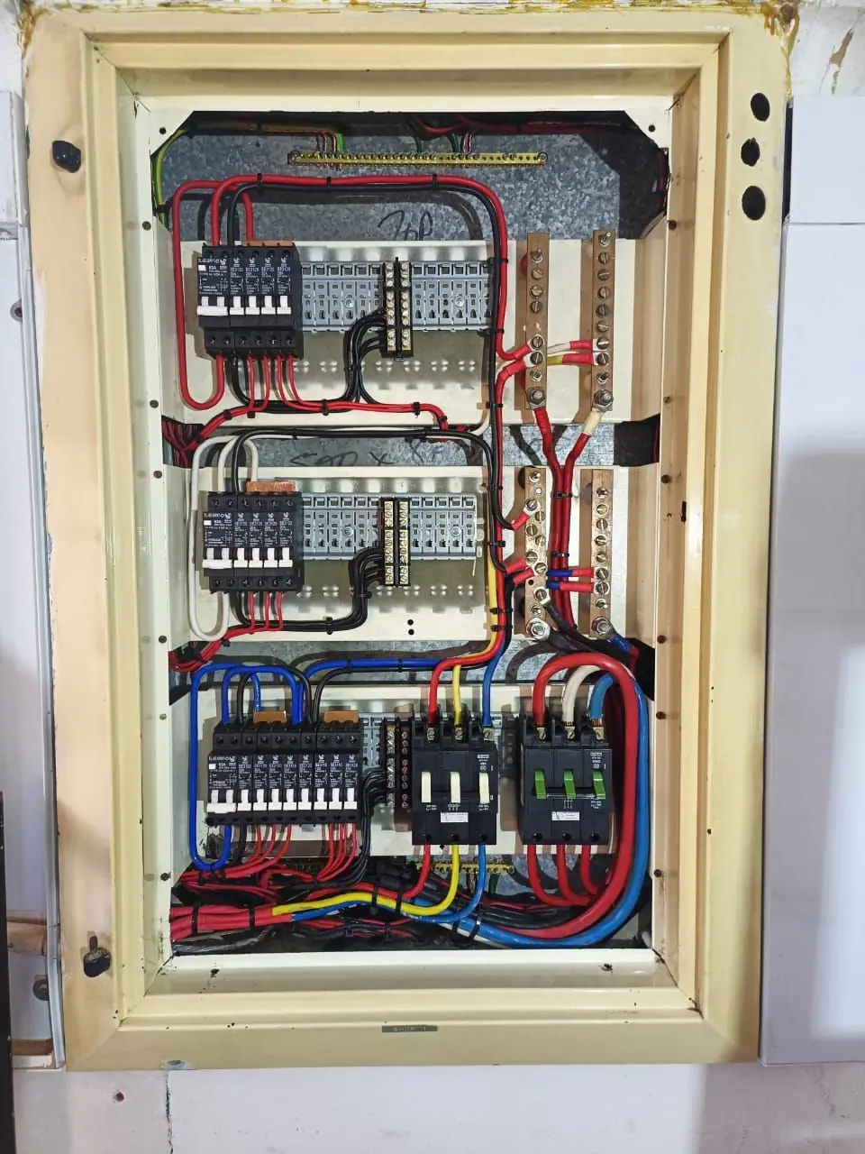 A rewired distribution board with neatly dressed cabling and new breakers
