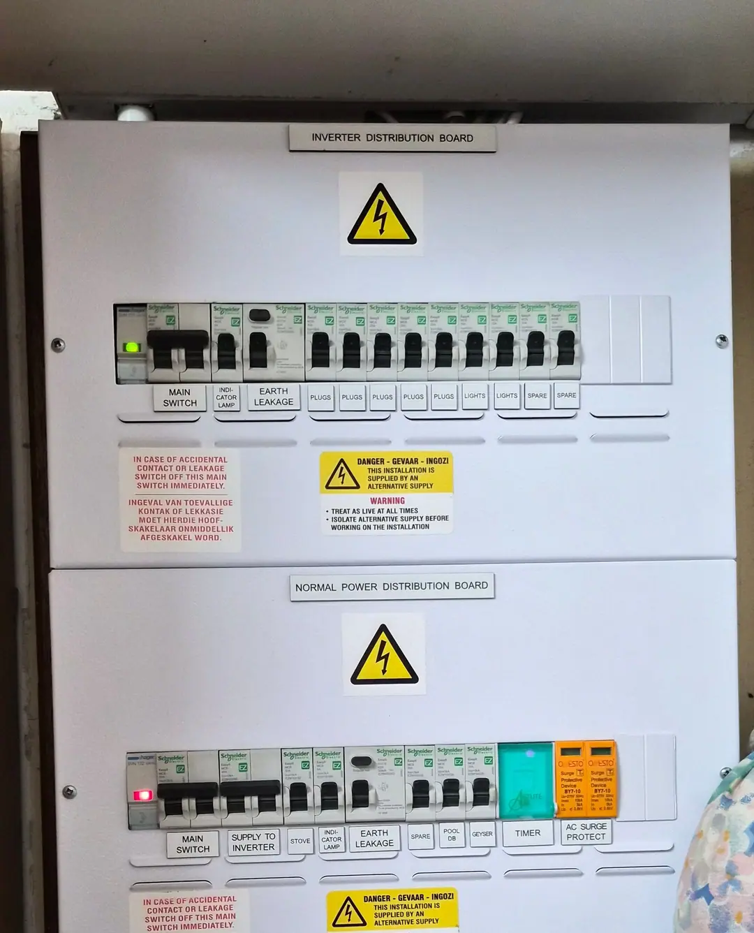 An inverter distribution board above a normal-power distribution board